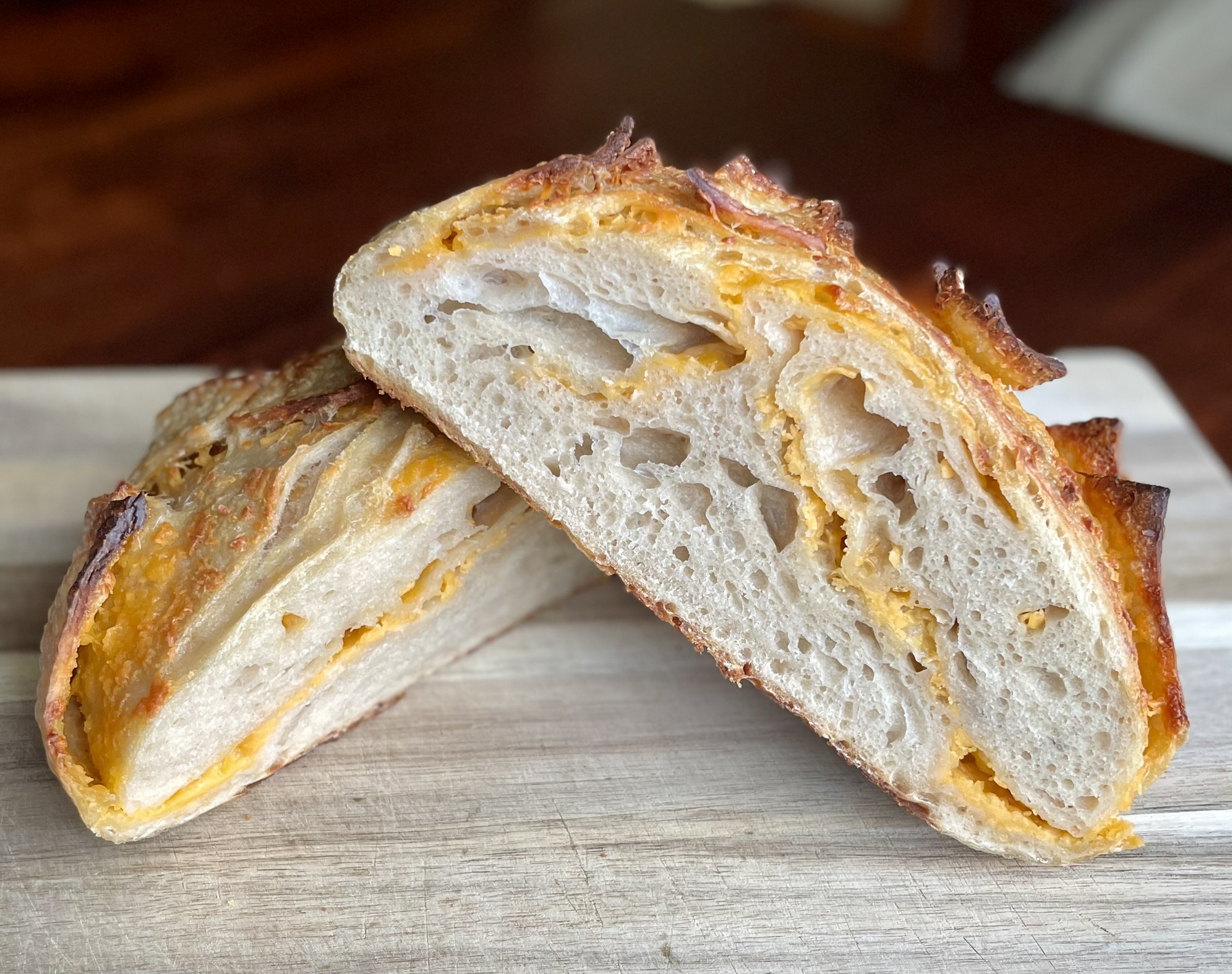 Cheddar sourdough sliced showing cheesy crumb
