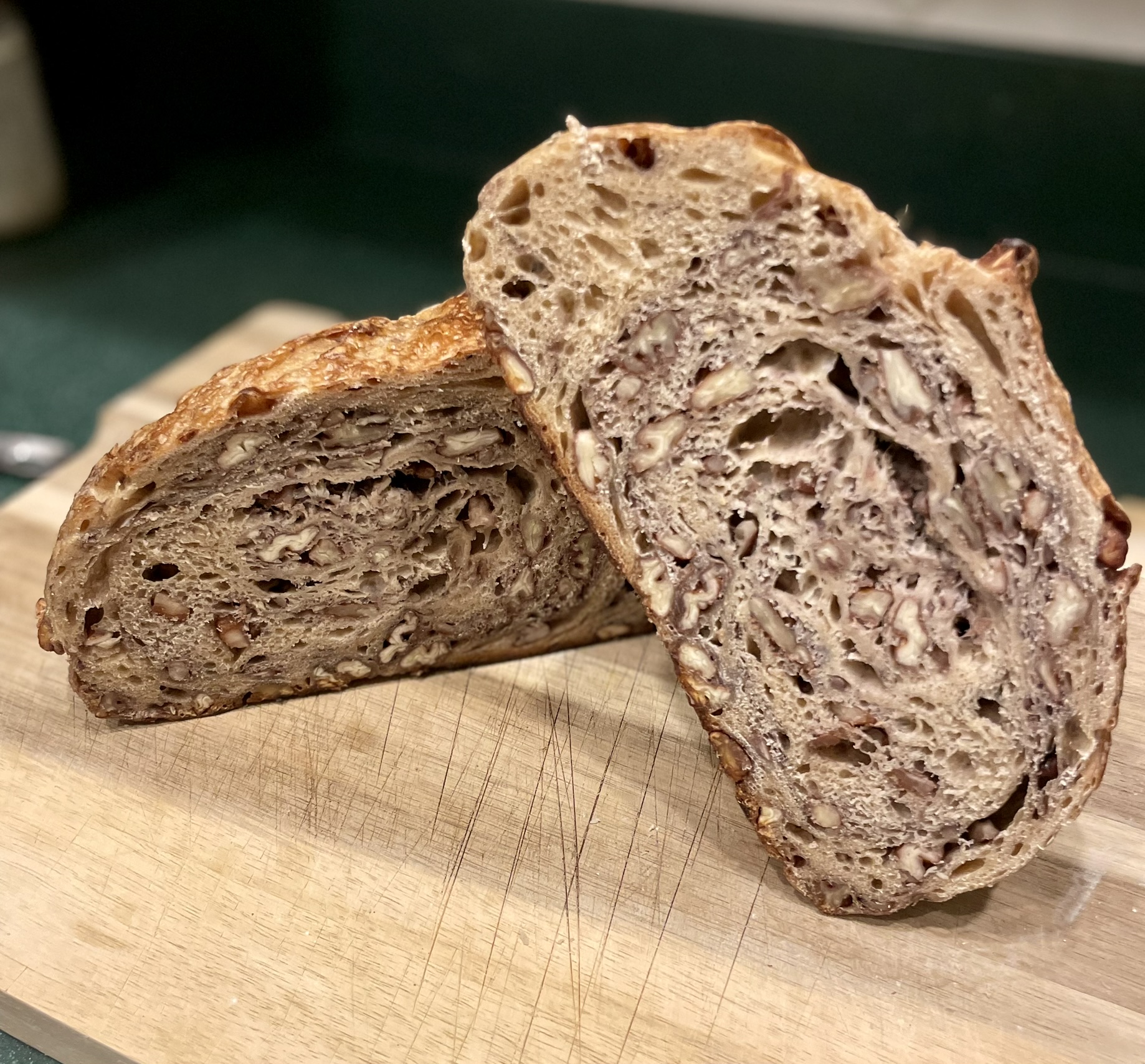 Maple nut sourdough cut open showing nut-filled swirled crumb