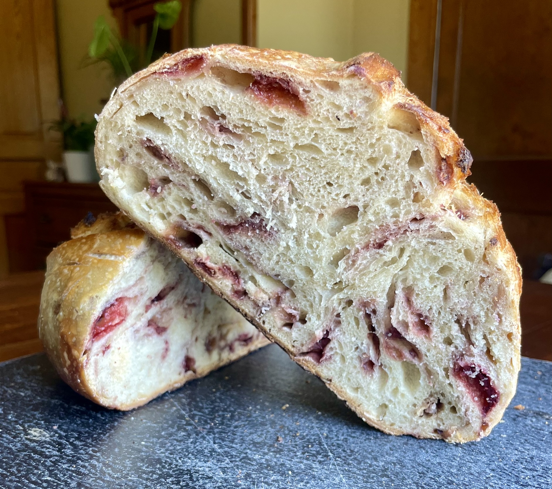 Strawberry sourdough cross section showing berry-studded crumb